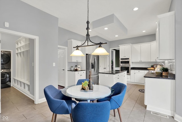 1410 Shadow Ct, Zionsville, IN 46077 - dining room with stacked washer / dryer and recessed lighting
