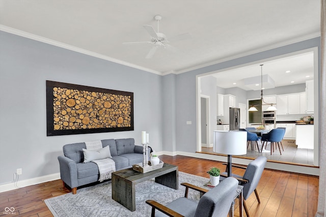 1410 Shadow Ct, Zionsville, IN 46077 - living area featuring hardwood / wood-style flooring, a ceiling fan, ornamental molding, and recessed lighting