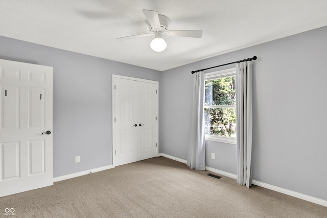 1410 Shadow Ct, Zionsville, IN 46077 - unfurnished bedroom featuring carpet flooring, a closet, and ceiling fan