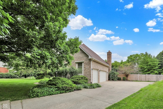 1410 Shadow Ct, Zionsville, IN 46077 - view of side of property with brick siding, a chimney, a garage, and driveway