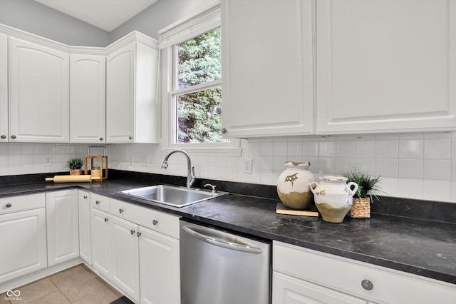1410 Shadow Ct, Zionsville, IN 46077 - kitchen featuring stainless steel dishwasher, white cabinetry, decorative backsplash, and light tile patterned floors