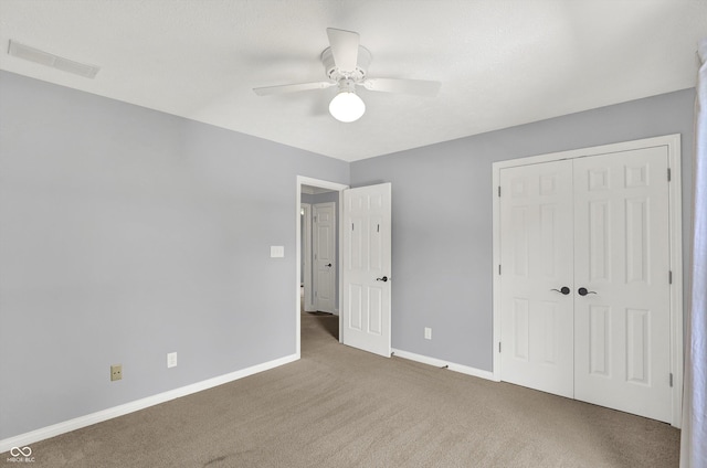 1410 Shadow Ct, Zionsville, IN 46077 - unfurnished bedroom with carpet floors, a closet, and a ceiling fan