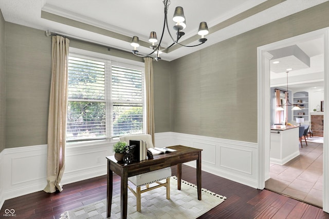 1410 Shadow Ct, Zionsville, IN 46077 - home office with wallpapered walls, dark wood-type flooring, healthy amount of natural light, a chandelier, and wainscoting