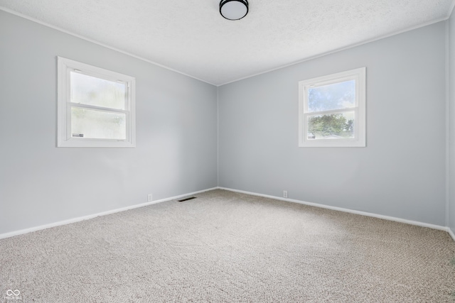 903 Sunset Dr, Lebanon, IN 46052 - spare room featuring carpet floors, baseboards, and a textured ceiling
