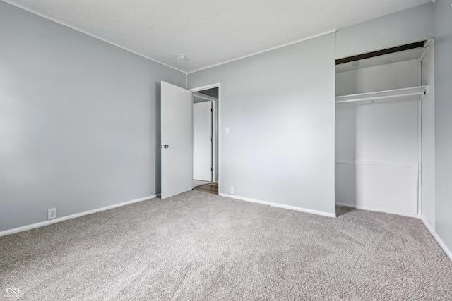 903 Sunset Dr, Lebanon, IN 46052 - unfurnished bedroom featuring carpet floors, a closet, and baseboards