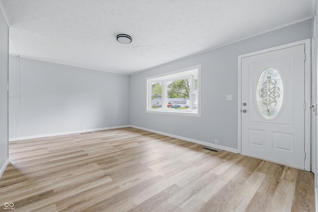 903 Sunset Dr, Lebanon, IN 46052 - entrance foyer featuring light wood-type flooring, baseboards, and a textured ceiling
