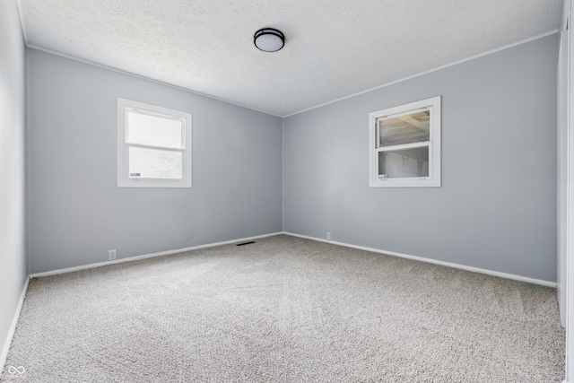 903 Sunset Dr, Lebanon, IN 46052 - unfurnished room featuring carpet flooring, a textured ceiling, baseboards, and crown molding