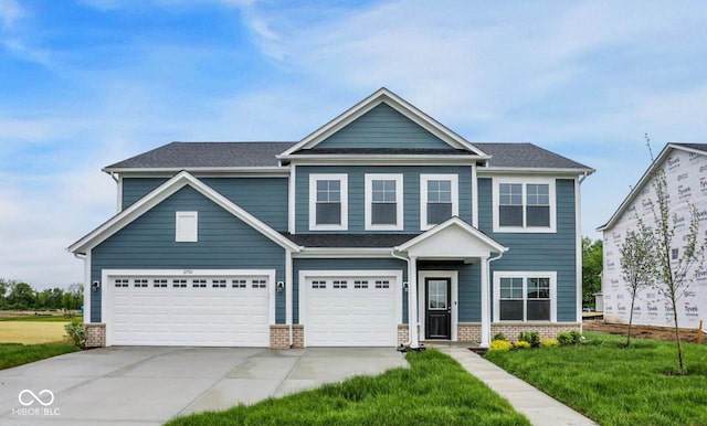 2750 Glade Ave, Plainfield, IN 46168 - craftsman-style house with driveway, a front lawn, and a garage