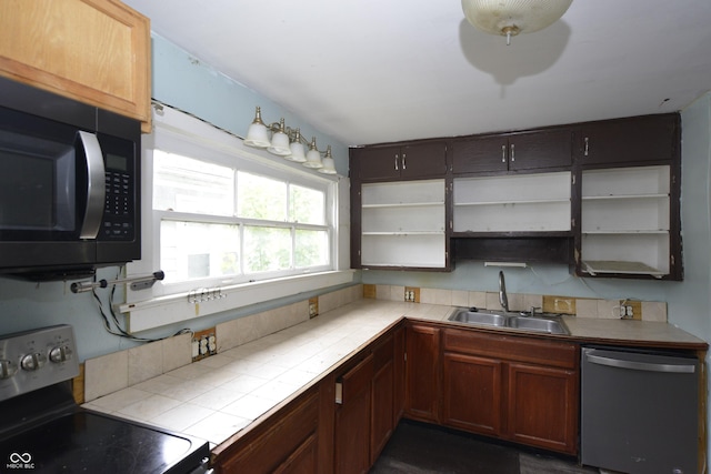 364 S Cole St, Indianapolis, IN 46241 - kitchen with stainless steel appliances, a sink, open shelves, and tile countertops
