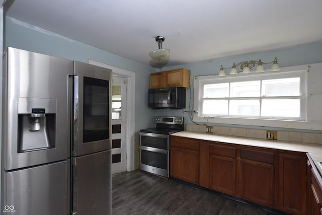 364 S Cole St, Indianapolis, IN 46241 - kitchen featuring stainless steel appliances, tile countertops, dark wood finished floors, and brown cabinets