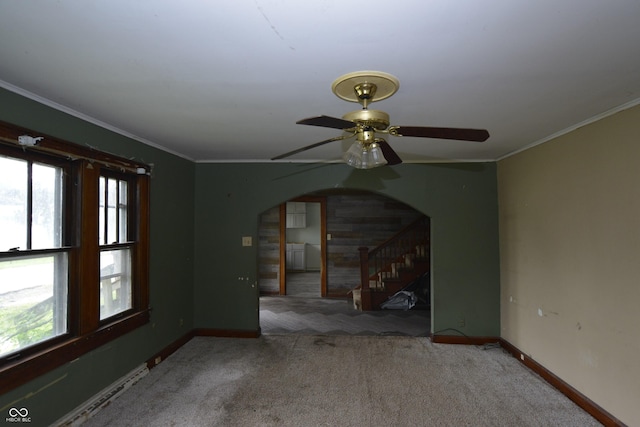 364 S Cole St, Indianapolis, IN 46241 - spare room featuring carpet floors, healthy amount of natural light, stairway, baseboards, and crown molding