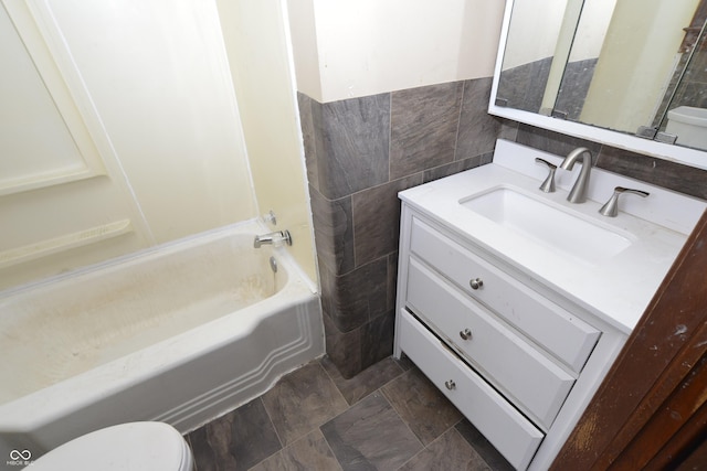 364 S Cole St, Indianapolis, IN 46241 - full bathroom with toilet, vanity, tile walls, and shower / bath combination