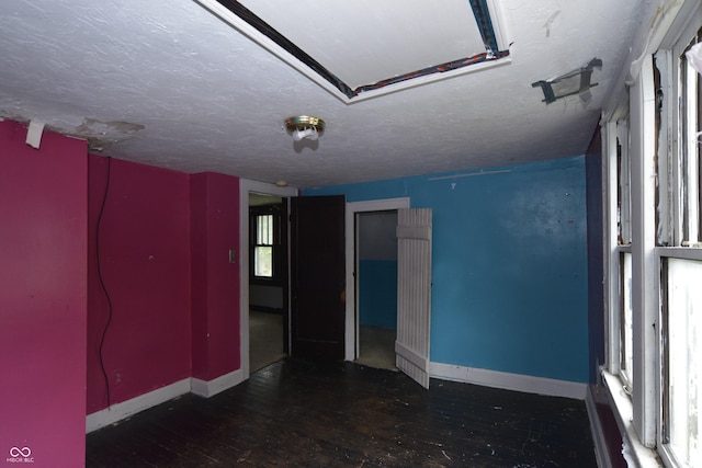 364 S Cole St, Indianapolis, IN 46241 - spare room featuring baseboards, hardwood / wood-style flooring, and a textured ceiling