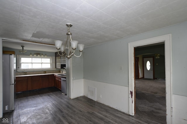 364 S Cole St, Indianapolis, IN 46241 - kitchen with stainless steel appliances, a sink, light countertops, a chandelier, and dark wood finished floors
