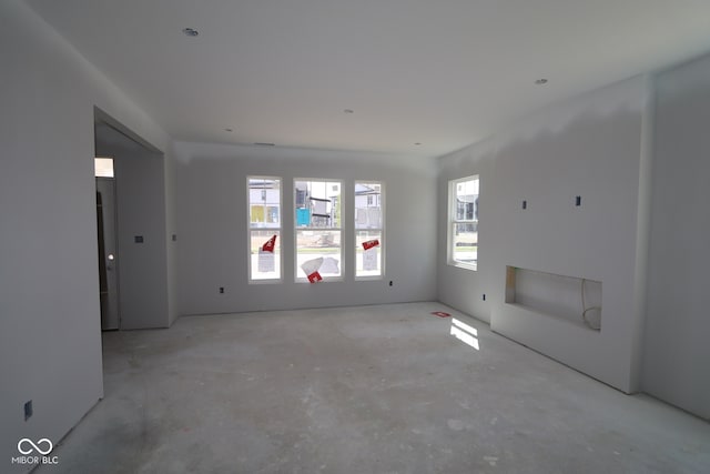 1813 Real St, Indianapolis, IN 46240 - unfurnished living room featuring concrete floors