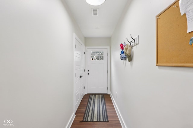 617 N Dearborn St, Indianapolis, IN 46201 - doorway to outside featuring dark wood-type flooring and baseboards