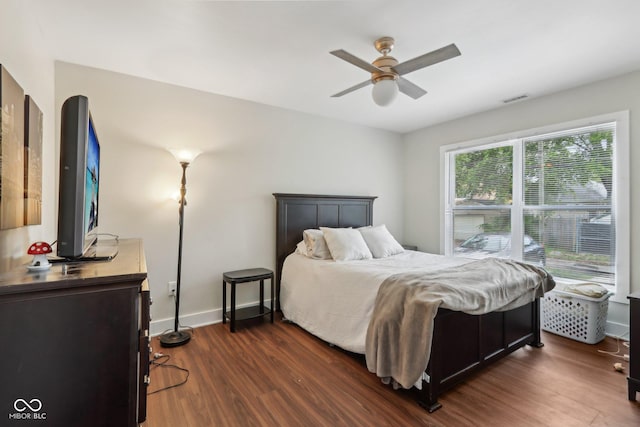 617 N Dearborn St, Indianapolis, IN 46201 - bedroom with dark wood finished floors, baseboards, and a ceiling fan