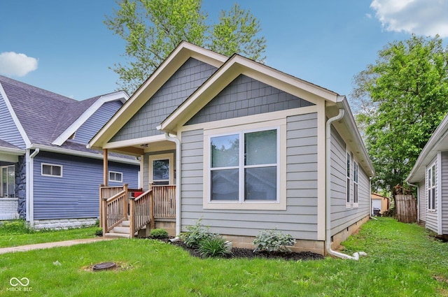 617 N Dearborn St, Indianapolis, IN 46201 - view of front facade with a front lawn and a porch