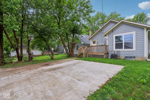 617 N Dearborn St, Indianapolis, IN 46201 - back of property with a deck and a lawn