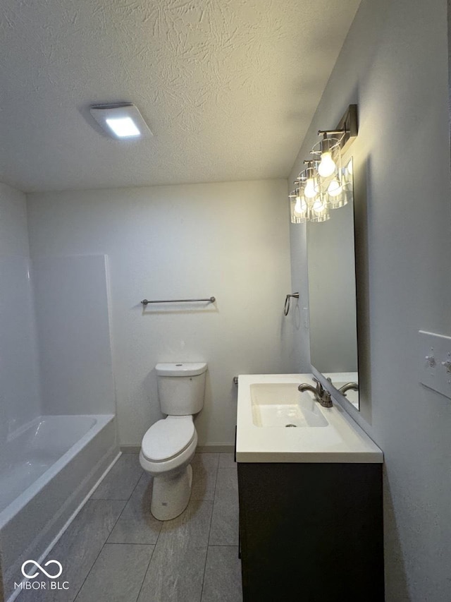 317 W Pierson St, Greenfield, IN 46140 - bathroom featuring vanity, toilet, and a textured ceiling