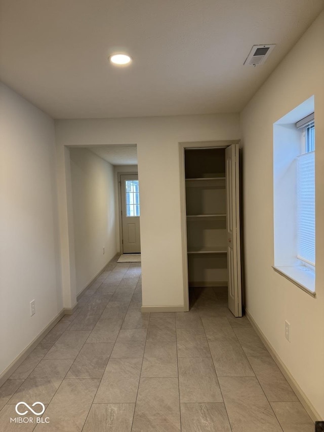 317 W Pierson St, Greenfield, IN 46140 - unfurnished bedroom featuring recessed lighting, a closet, baseboards, and light tile patterned flooring