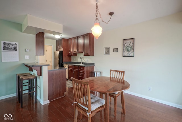 3965 N Meridian St Unit 3J, West, Indianapolis, IN 46208 - dining space with dark wood-type flooring and baseboards