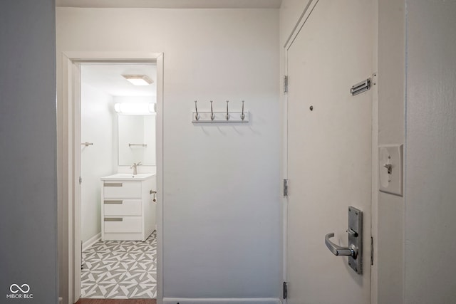 3965 N Meridian St Unit 3J, West, Indianapolis, IN 46208 - hallway featuring a sink and baseboards