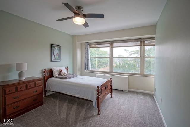 3965 N Meridian St Unit 3J, West, Indianapolis, IN 46208 - carpeted bedroom featuring radiator, baseboards, and ceiling fan
