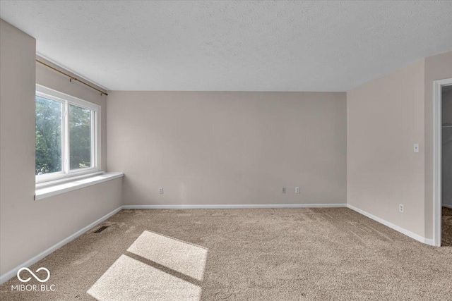 8908 Sunningdale Blvd, Indianapolis, IN 46234 - carpeted spare room featuring a textured ceiling and baseboards
