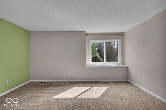 8908 Sunningdale Blvd, Indianapolis, IN 46234 - empty room featuring carpet floors and a textured ceiling