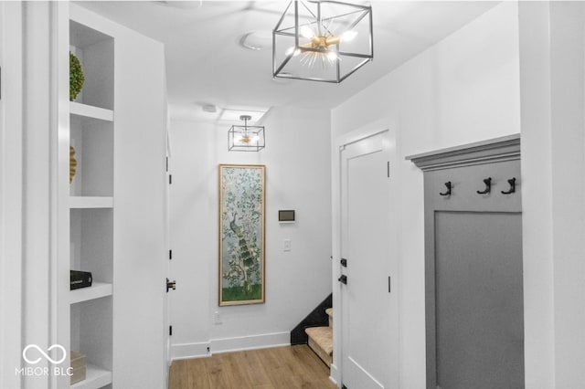 420 Monon Wy Dr, Carmel, IN 46032 - mudroom featuring light wood-style flooring, a chandelier, and baseboards
