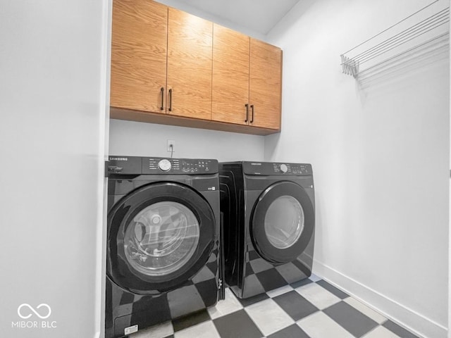 420 Monon Wy Dr, Carmel, IN 46032 - laundry room with light floors, washing machine and dryer, cabinet space, and baseboards
