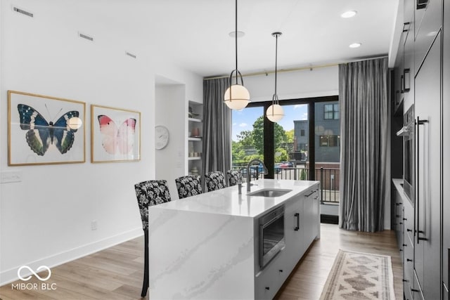 420 Monon Wy Dr, Carmel, IN 46032 - kitchen featuring a sink, stainless steel appliances, light wood-style flooring, hanging light fixtures, and recessed lighting