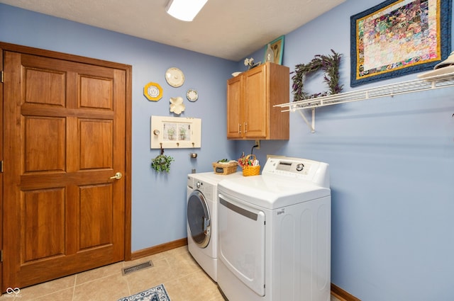 1607 Michelle Mnr, Danville, IN 46122 - washroom with washer and dryer, cabinet space, baseboards, and light tile patterned floors
