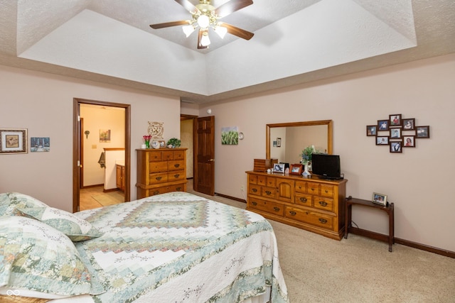 1607 Michelle Mnr, Danville, IN 46122 - bedroom featuring a tray ceiling, light colored carpet, ceiling fan, ensuite bath, and baseboards