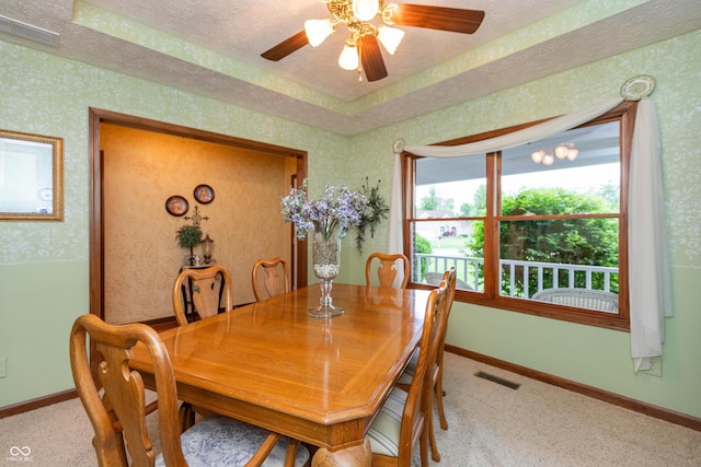 1607 Michelle Mnr, Danville, IN 46122 - dining room with baseboards, carpet, wallpapered walls, a ceiling fan, and a textured ceiling