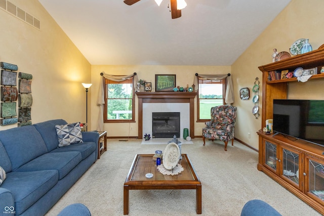 1607 Michelle Mnr, Danville, IN 46122 - carpeted living area with a fireplace, lofted ceiling, healthy amount of natural light, ceiling fan, and baseboards
