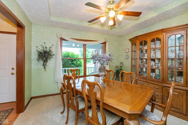 1607 Michelle Mnr, Danville, IN 46122 - dining space featuring ceiling fan, baseboards, light colored carpet, wallpapered walls, and a raised ceiling