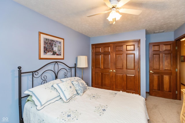 1607 Michelle Mnr, Danville, IN 46122 - carpeted bedroom with a closet, a textured ceiling, and ceiling fan