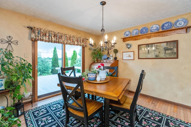 1607 Michelle Mnr, Danville, IN 46122 - dining space with hardwood / wood-style flooring, a chandelier, and baseboards
