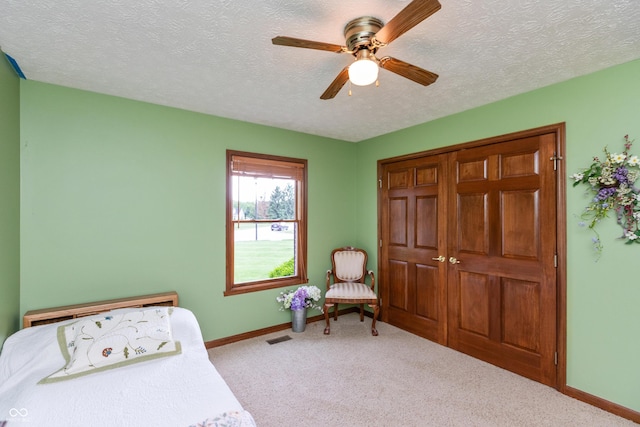 1607 Michelle Mnr, Danville, IN 46122 - bedroom featuring baseboards, carpet, a textured ceiling, a ceiling fan, and a closet