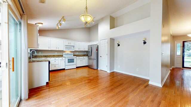 3959 Towhees Dr, Indianapolis, IN 46237 - kitchen featuring white appliances, a sink, white cabinetry, light wood-type flooring, and baseboards