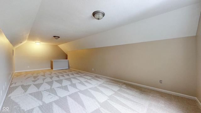 3959 Towhees Dr, Indianapolis, IN 46237 - bonus room with light carpet, vaulted ceiling, and baseboards