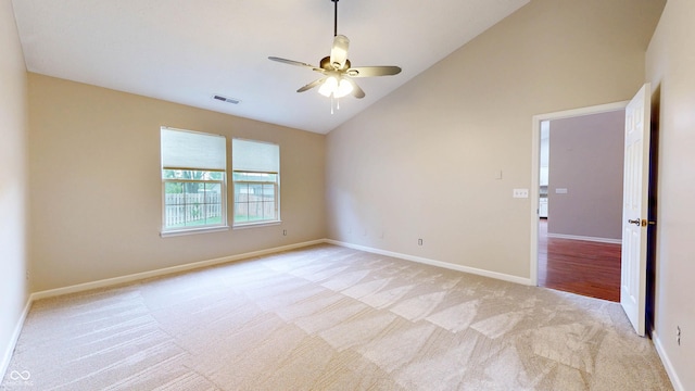 3959 Towhees Dr, Indianapolis, IN 46237 - spare room with light carpet, ceiling fan, baseboards, and high vaulted ceiling