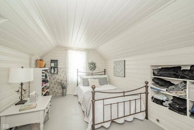 311 Northshore Blvd, Anderson, IN 46011 - bedroom featuring vaulted ceiling and wood walls