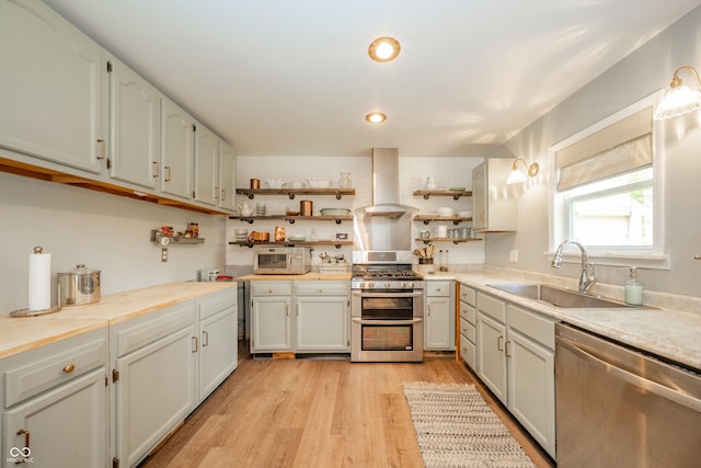 311 Northshore Blvd, Anderson, IN 46011 - kitchen featuring appliances with stainless steel finishes, extractor fan, a sink, open shelves, and light countertops