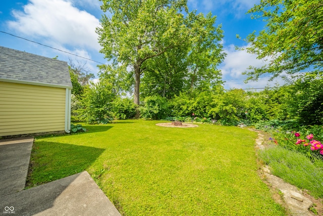 311 Northshore Blvd, Anderson, IN 46011 - view of green lawn with an outdoor fire pit