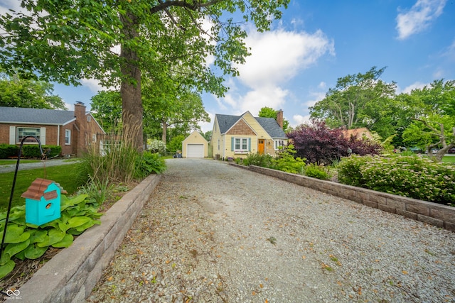 311 Northshore Blvd, Anderson, IN 46011 - view of front facade with driveway, a garage, a chimney, and brick siding