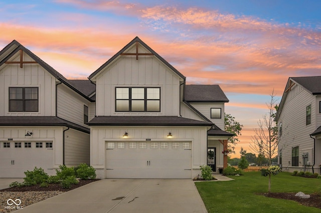 17551 Gruner Way, Westfield, IN 46062 - view of front facade featuring board and batten siding, a garage, and a yard