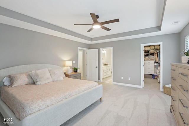 17551 Gruner Way, Westfield, IN 46062 - bedroom with a tray ceiling, a spacious closet, light colored carpet, baseboards, and a closet